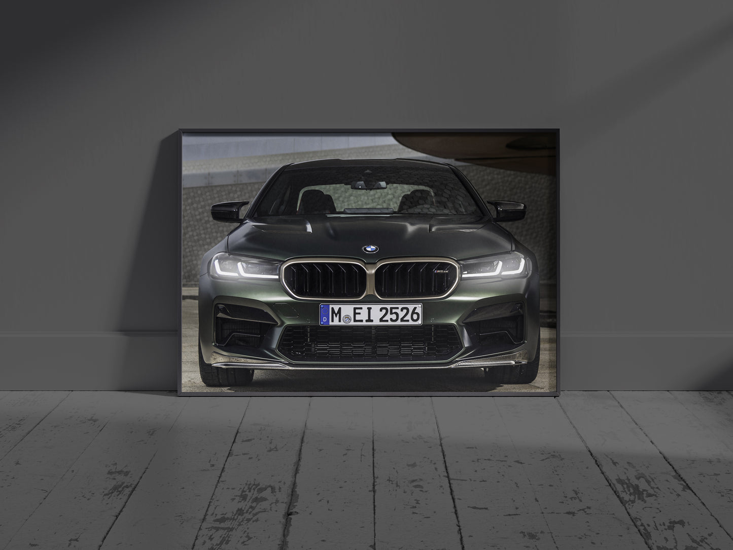 BMW M5 CS neon LED light frame wall art glowing vividly in a dark room setting
