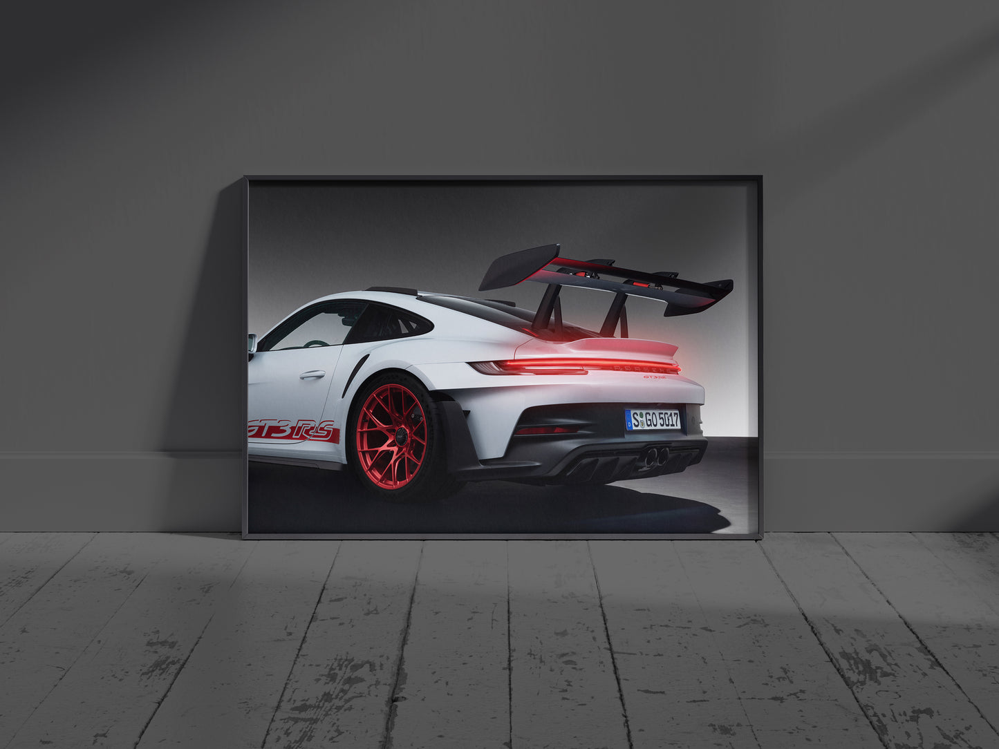 Modern living room interior mockup featuring an illuminated Porsche 911 GT3 RS supercar neon sign hung above a sofa.