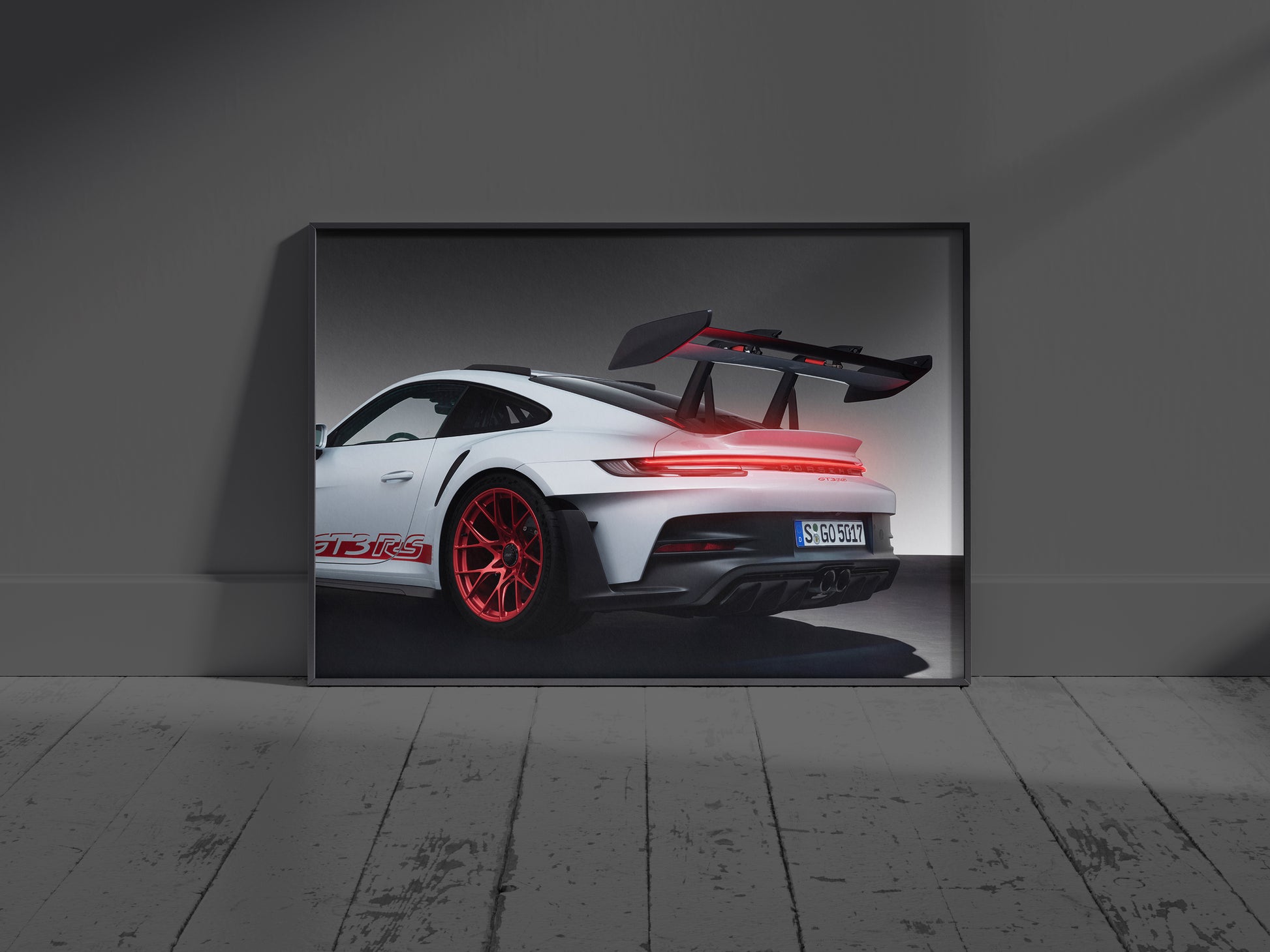 Modern living room interior mockup featuring an illuminated Porsche 911 GT3 RS supercar neon sign hung above a sofa.