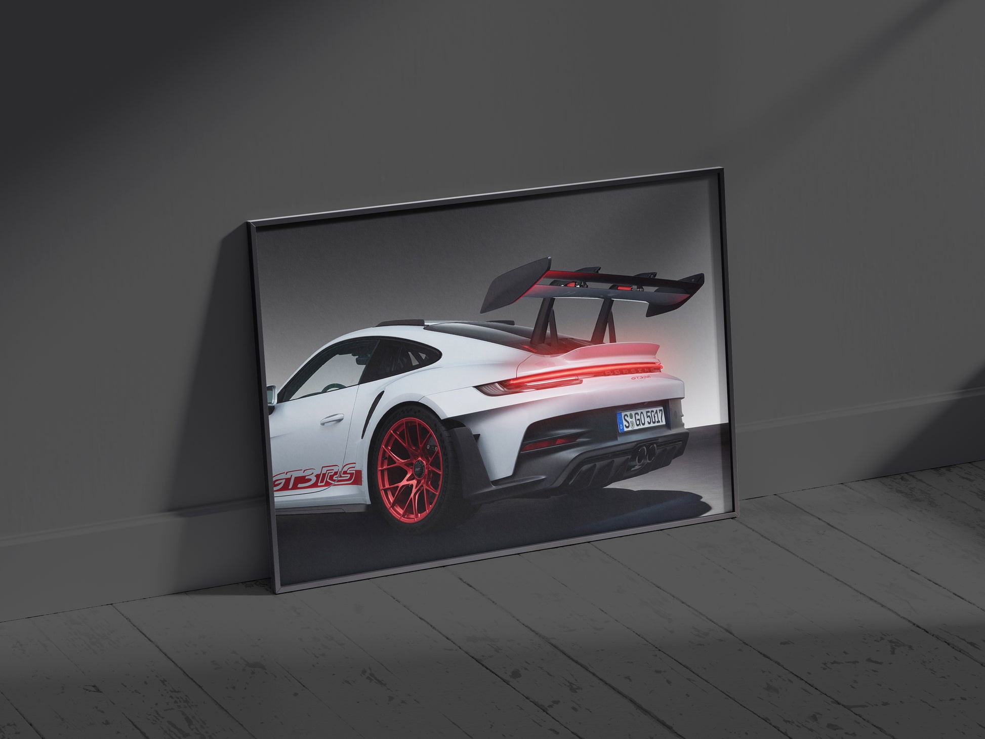 Porsche 911 GT3 RS neon LED back light frame wall art glowing vividly in a dark room setting.